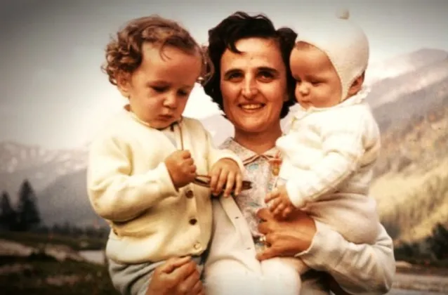 St Gianna Beretta Molla carrying two of her young children.